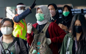 Heboh Batu Nisan Bermasker, Ingatkan Masyarakat Ancaman Pandemi COVID-19 Belum Berakhir