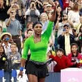 Serena Williams melambaikan tangan ke penonton usai mengalahkan Anastasia Rodionova (Australia)