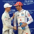 Jenson Button dan Michael Schumacher di Malaysia F1 Grand Pix